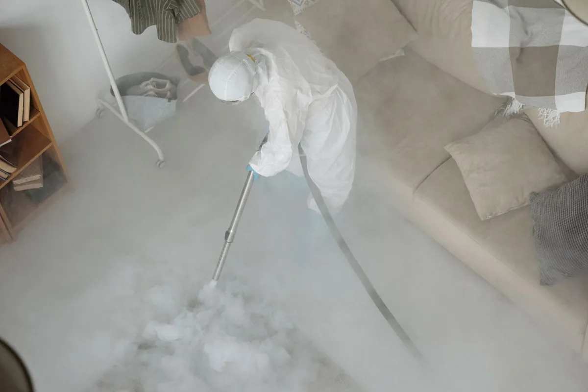 Biohazard cleanup technician in protective equipment, Cedarhurst, NY